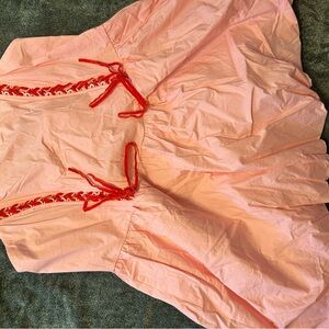 Elegant Pink Dress with Red Accents